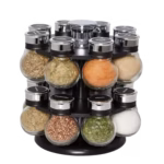 Compact Kamenstein 16-jar revolving spice rack with chrome plastic base and jars with sifter caps.