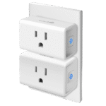 Two compact white Kasa Smart Plug Minis installed in a dual wall outlet without blocking space.