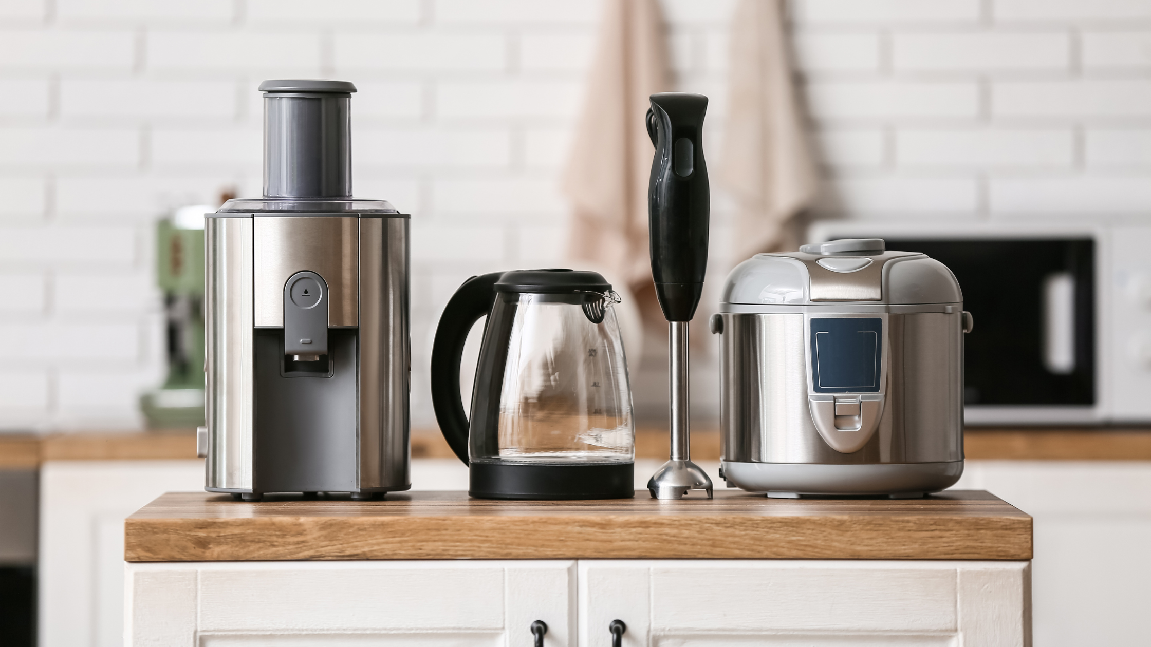 Collection of electric appliances including blender, toaster, kettle, and microwave – energy efficient home kitchen devices